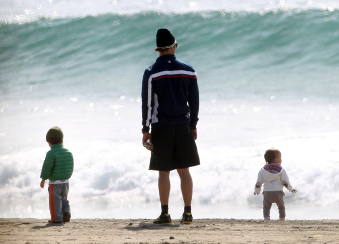 Matthew Mcconaughey with him children Levi and Vida on the beach